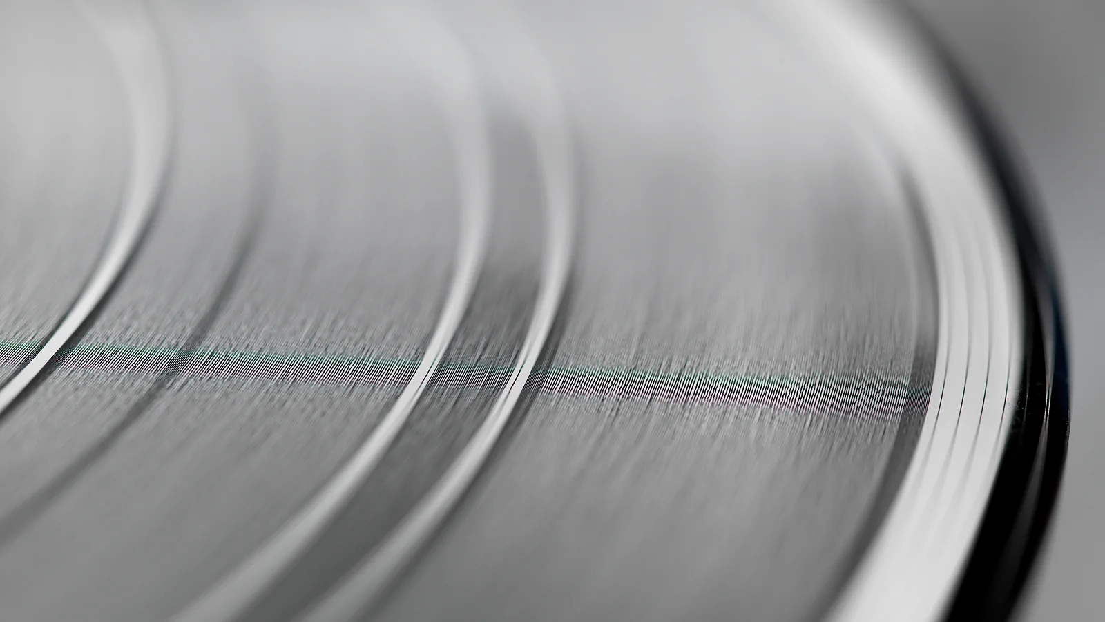 Audio advertising – macro photography of the grooves on a vinyl record